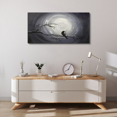 Tableau toile imprimée Un oiseau solitaire sur une branche