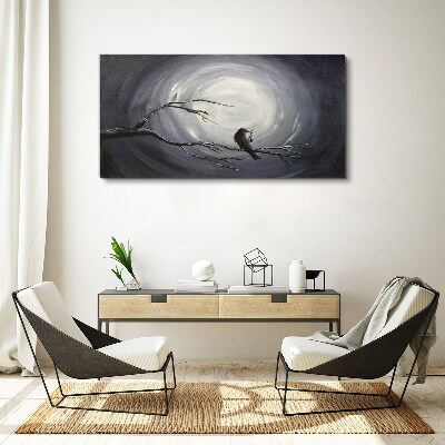 Tableau toile imprimée Un oiseau solitaire sur une branche