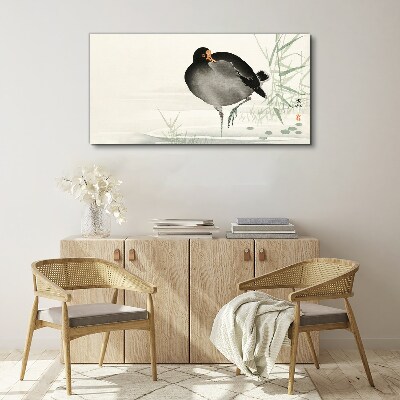 Tableau sur toile Un oiseau sur l'herbe