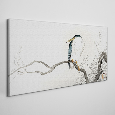 Tableau imprimé sur toile Un oiseau sur une branche dans un paysage délicat