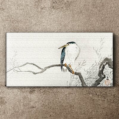 Tableau imprimé sur toile Un oiseau sur une branche dans un paysage délicat