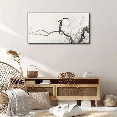 Tableau imprimé sur toile Un oiseau sur une branche dans un paysage délicat