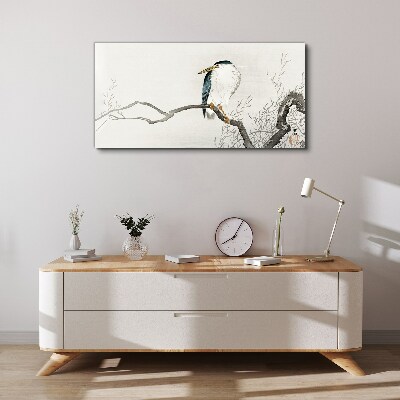 Tableau imprimé sur toile Un oiseau sur une branche dans un paysage délicat