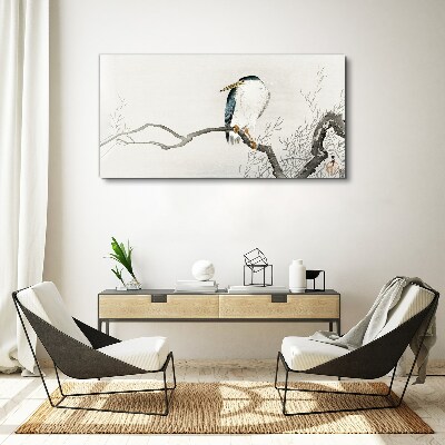 Tableau imprimé sur toile Un oiseau sur une branche dans un paysage délicat