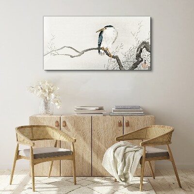 Tableau imprimé sur toile Un oiseau sur une branche dans un paysage délicat