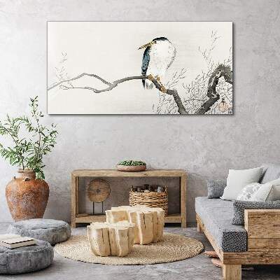 Tableau imprimé sur toile Un oiseau sur une branche dans un paysage délicat