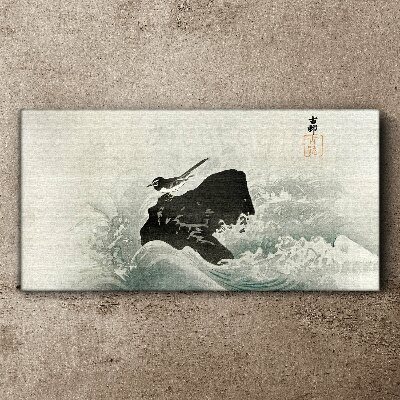 Tableau toile imprimée Un oiseau sur un rocher dans les vagues