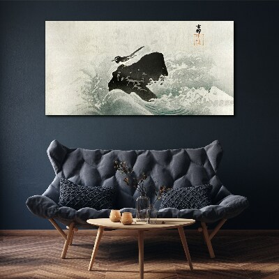 Tableau toile imprimée Un oiseau sur un rocher dans les vagues