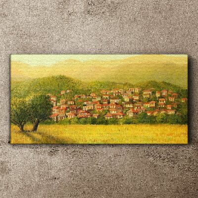 Tableau sur toile Un village ensoleillé au milieu des collines