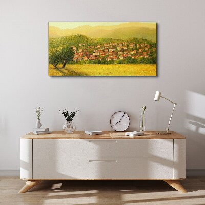 Tableau sur toile Un village ensoleillé au milieu des collines