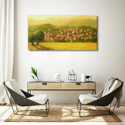 Tableau sur toile Un village ensoleillé au milieu des collines