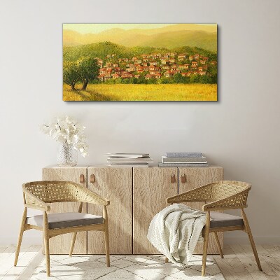 Tableau sur toile Un village ensoleillé au milieu des collines