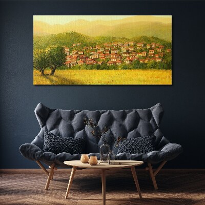 Tableau sur toile Un village ensoleillé au milieu des collines