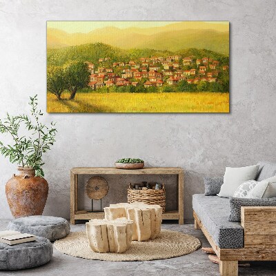 Tableau sur toile Un village ensoleillé au milieu des collines