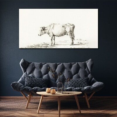 Tableau toile imprimée Une vache calme sur fond de nature