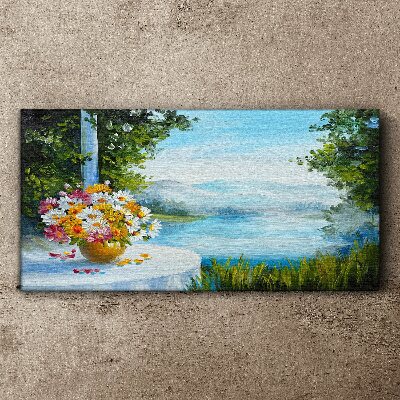 Tableau sur toile Un bouquet de fleurs au bord du lac