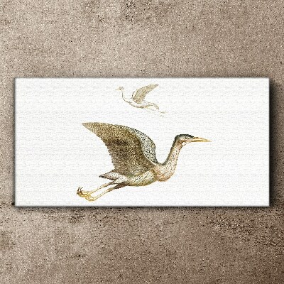 Tableau imprimé sur toile Le vol d'un oiseau au-dessus d'une eau calme