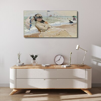 Tableau sur toile Femme sur la plage avec un parasol