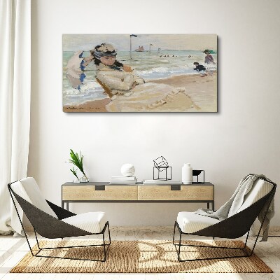 Tableau sur toile Femme sur la plage avec un parasol