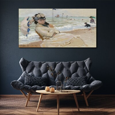 Tableau sur toile Femme sur la plage avec un parasol