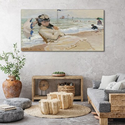 Tableau sur toile Femme sur la plage avec un parasol