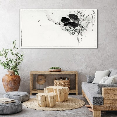 Tableau imprimé sur toile Oiseaux noirs sur une branche
