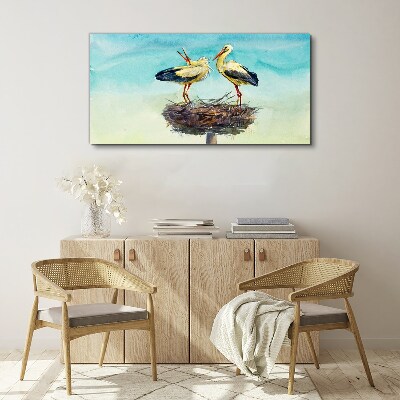 Tableau toile imprimée Cigognes sur un nid dans le bleu