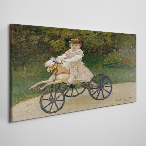Tableau imprimé sur toile Enfant sur un porteur