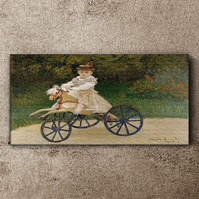 Tableau imprimé sur toile Enfant sur un porteur