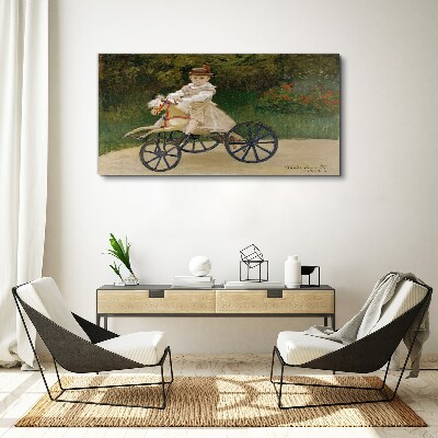 Tableau imprimé sur toile Enfant sur un porteur