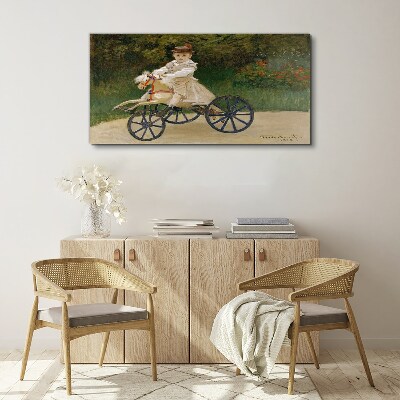 Tableau imprimé sur toile Enfant sur un porteur