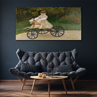 Tableau imprimé sur toile Enfant sur un porteur