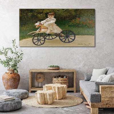 Tableau imprimé sur toile Enfant sur un porteur