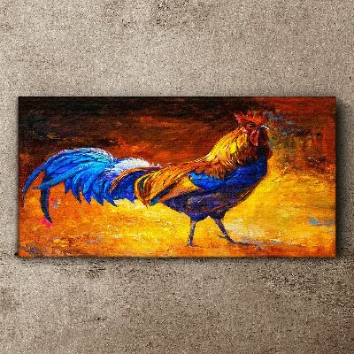 Tableau toile imprimée Un coq coloré sur fond de feu