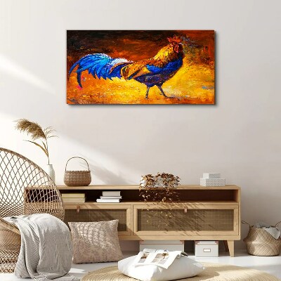 Tableau toile imprimée Un coq coloré sur fond de feu