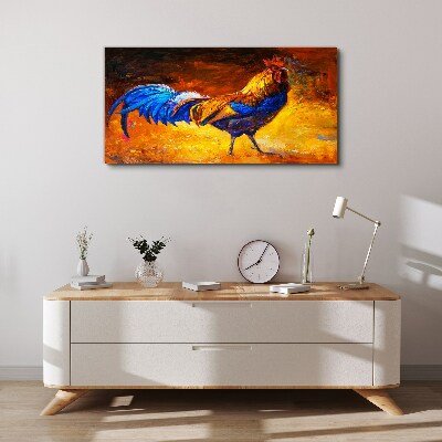 Tableau toile imprimée Un coq coloré sur fond de feu