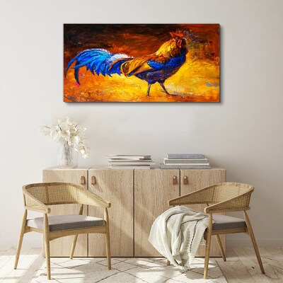 Tableau toile imprimée Un coq coloré sur fond de feu