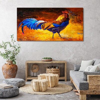 Tableau toile imprimée Un coq coloré sur fond de feu