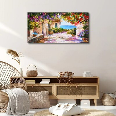 Tableau sur toile L'allée fleurie d'un village balnéaire