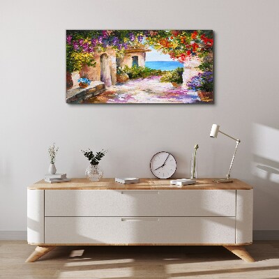 Tableau sur toile L'allée fleurie d'un village balnéaire