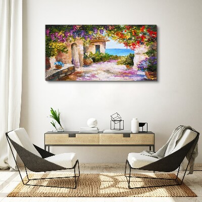 Tableau sur toile L'allée fleurie d'un village balnéaire