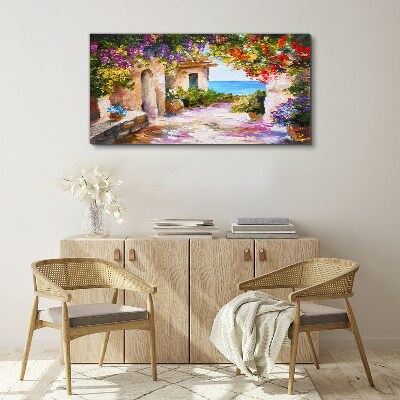 Tableau sur toile L'allée fleurie d'un village balnéaire