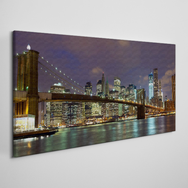 Tableau sur toile Le pont de Brooklyn dans la lueur nocturne