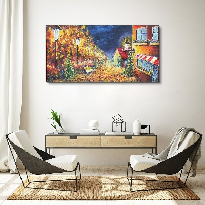 Tableau sur toile Avenue dorée à la lueur des lanternes