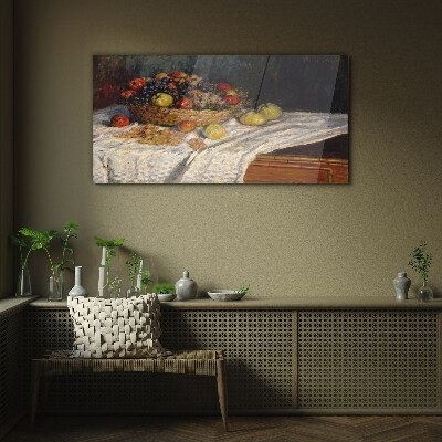 Tableau imprimé sur verre Corbeille de fruits sur une nappe blanche