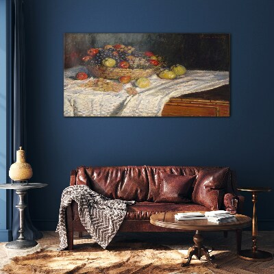 Tableau imprimé sur verre Corbeille de fruits sur une nappe blanche