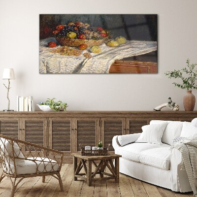 Tableau imprimé sur verre Corbeille de fruits sur une nappe blanche