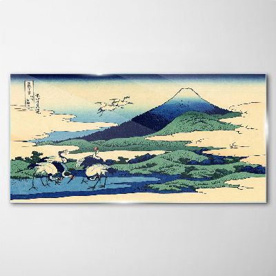 Tableau imprimé sur verre Grues près d'une montagne