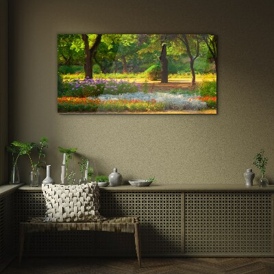 Tableau imprimé sur verre Un paradis de fleurs dans un jardin ensoleillé