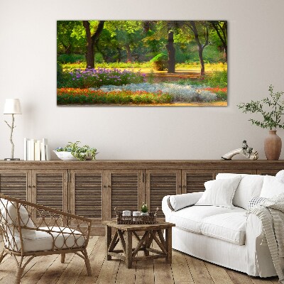 Tableau imprimé sur verre Un paradis de fleurs dans un jardin ensoleillé
